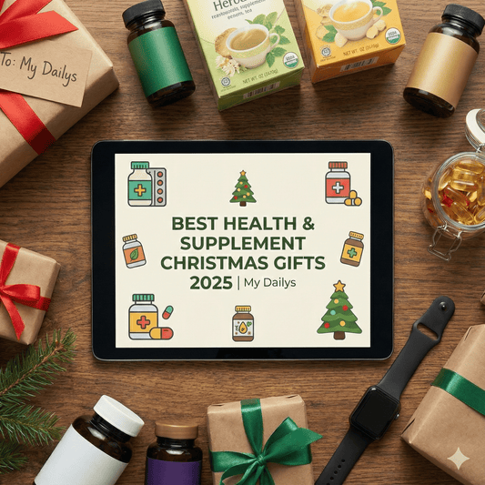 A flat lay photograph of health supplements and Christmas gifts surrounding a tablet displaying the title "BEST HEALTH & SUPPLEMENT CHRISTMAS GIFTS 2025 | My Dailys